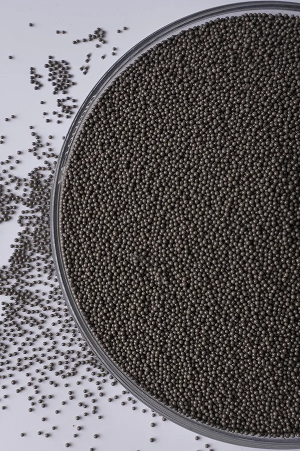 A bowl of dark brown catalyst resins.