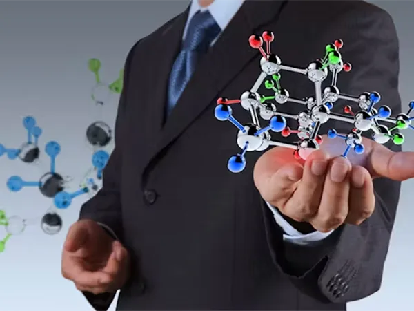 A man is holding a unit of chemical formula.